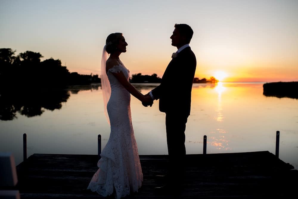 Couple on the dock on the Chesapeake Bay at one of the best wedding venues in Maryland