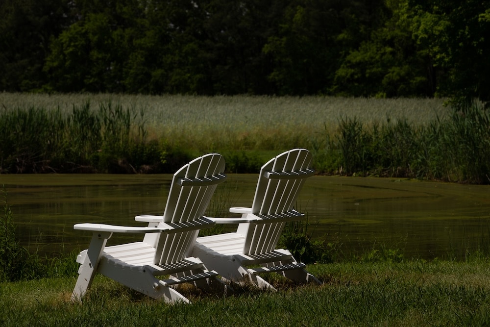 Plan Your Weekend Getaway from Washington D.C. for Couples 2 two chairs on the grounds of our Rock Hall Bed and Breakfast