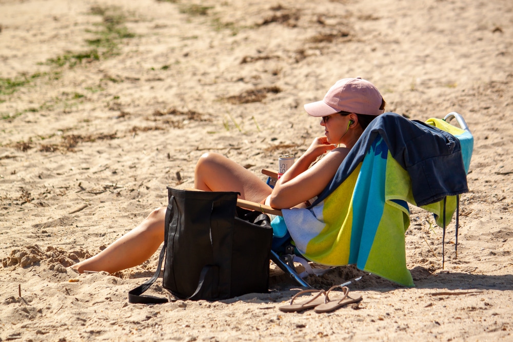 woman sitting at one of the mnay Chesapeake Bay Beaches near Rock Hall Maryland
