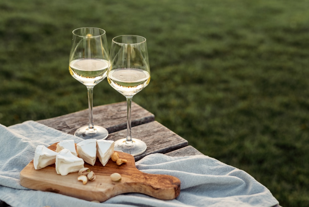 Two glasses of white wine and charcuterie at top Eastern Shore Wineries like Crow Vineyard