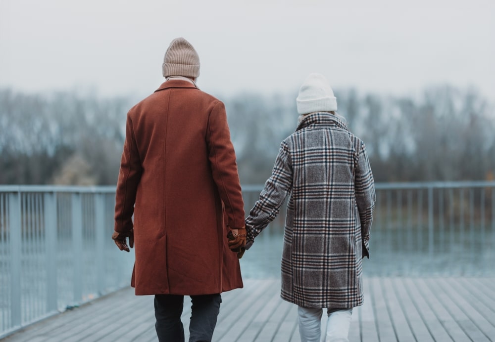 Couple enjoying a winter walk as they enjoy the top things to do on the Eastern Shore, during their weekend getaway from Philadelphia