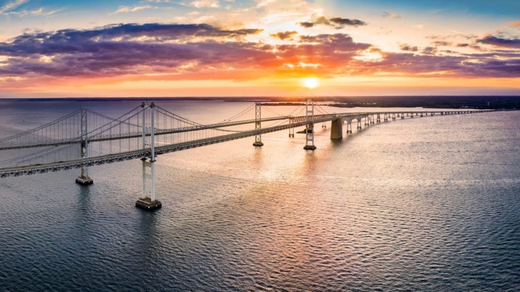 Aerial panorama of Chesapeake Bay Bridge at sunset. The Chesapeake Bay Bridge (known locally as the Bay Bridge) is a major dual-span bridge in the U.S. state of Maryland.